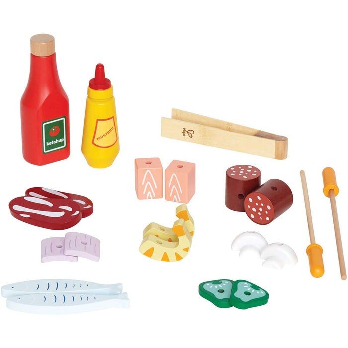 Pretend food, condiments and utensils  on a white background