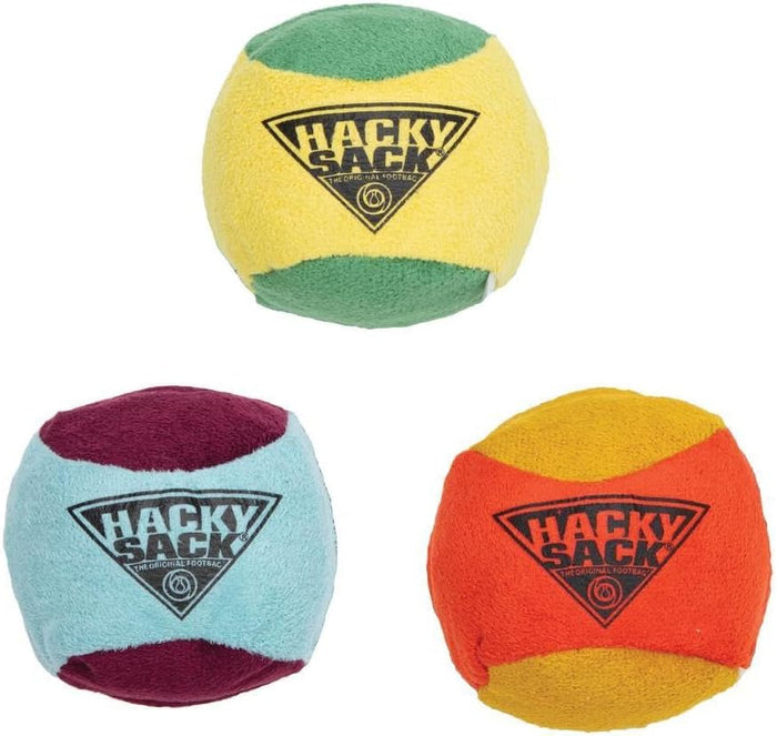 Three Hacky Sacks on a white background, each with a triangular black Hacky Sack logo. The top toy is yellow and green, the bottom-left is light blue and burgundy, and the bottom-right is orange and yellow.