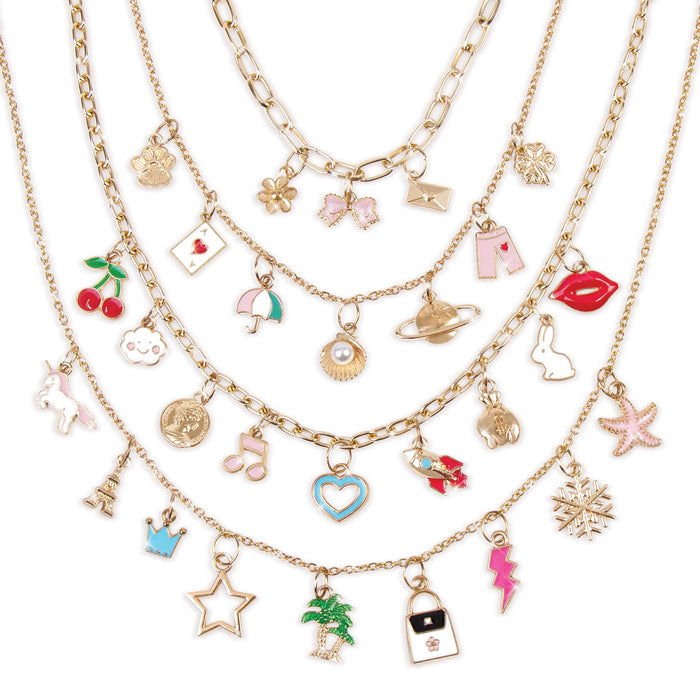 Four charm necklaces with various playful charms on gold chains displayed against a white background