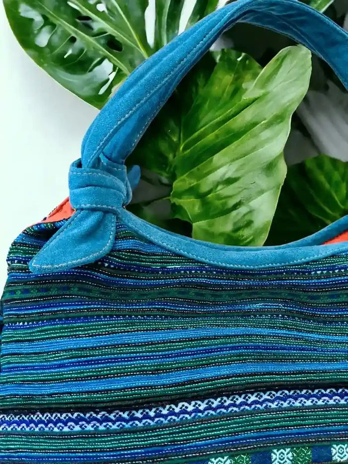 Vindigo handbag blue embroidered with orange lining side view