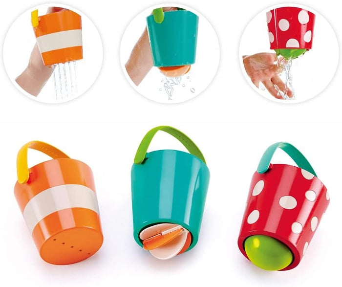 Three happy buckets, one orange, one teal, one red, on a white background.