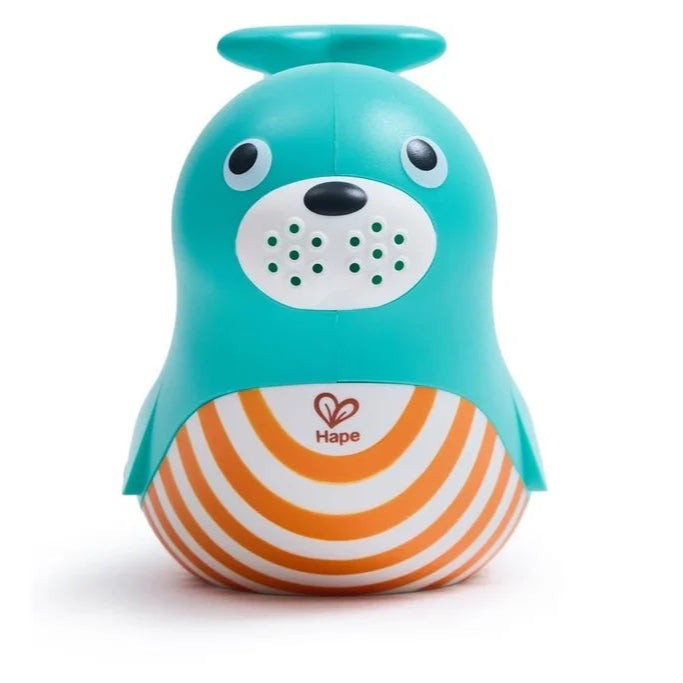 Front view of the multicolored plastic seal-shaped jug with a green body and white and orange stripes on the lower half, designed for water play.