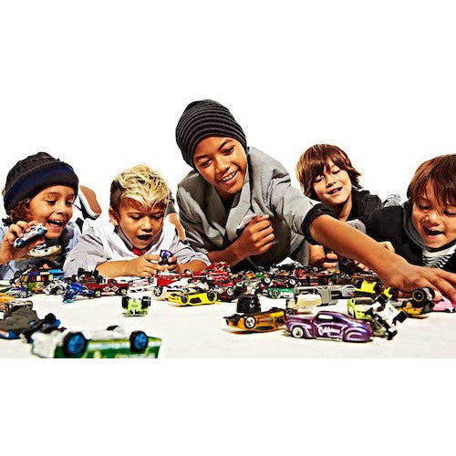 Kids playing with a collection of Hot Wheels on a white background