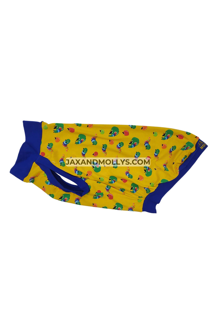 Yellow dog pajama with a caterpillar print and blue trim made by Jax & Molly's