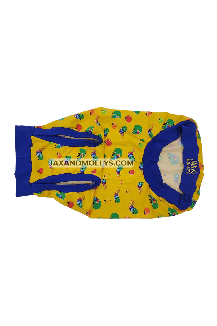 The underbelly of yellow dog pajama with a caterpillar print and blue trim made by Jax & Molly's