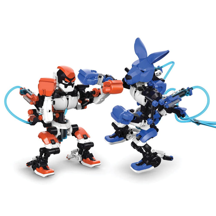 Two Hydraulic Boxing Bots, One white, black and orange and the other purple, black and white, on a white background.
