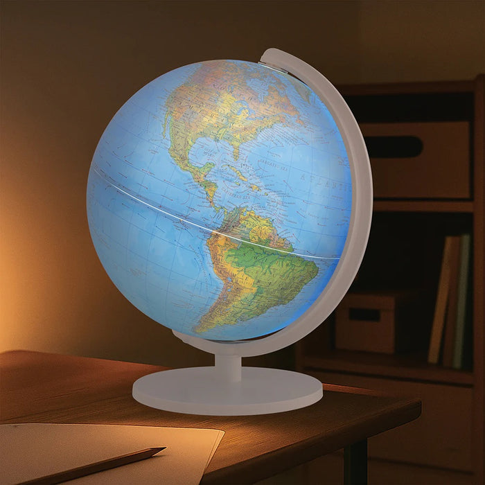 World globe on a wooden desk with a warm light ambiance
