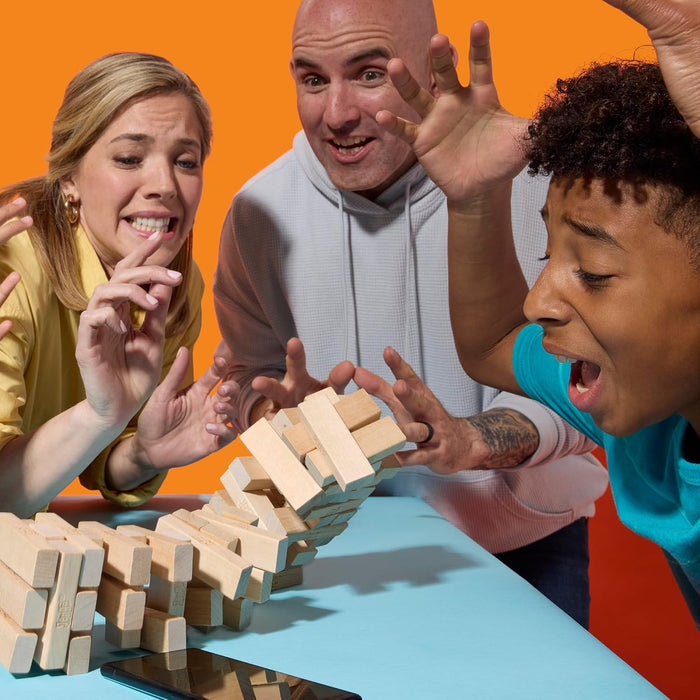 Three people playing with wooden blocks on a colorful background