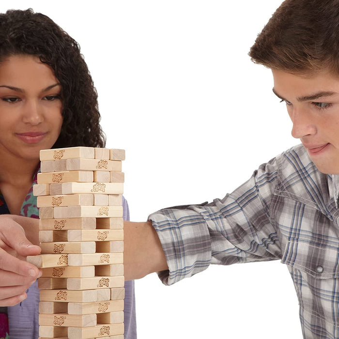 Two people playing Jenga on a white backround