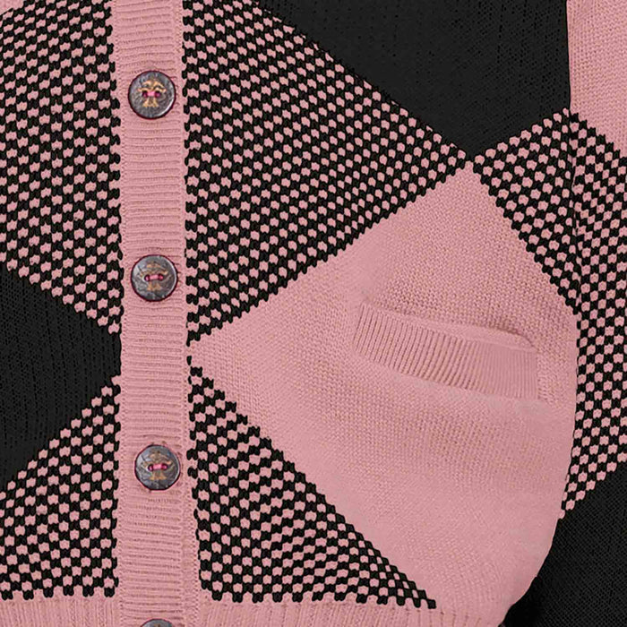 Close-up of contrast pink and black knit trim and embroidery detail