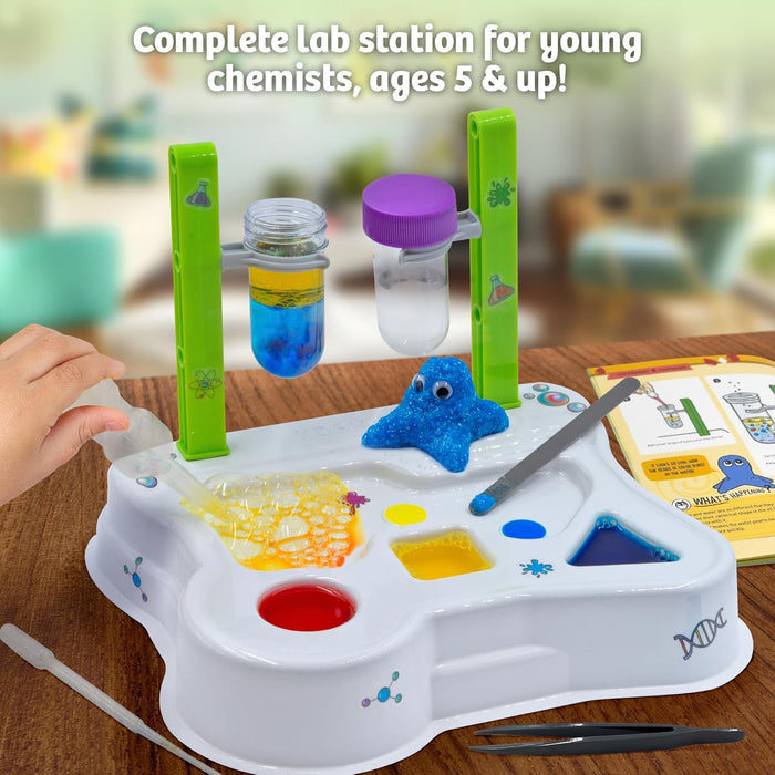 Toy lab station for young chemists with colorful components on a wooden surface.