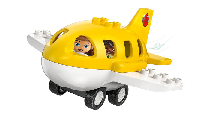 Toy plane with a yellow body and white rotor blades on a white background