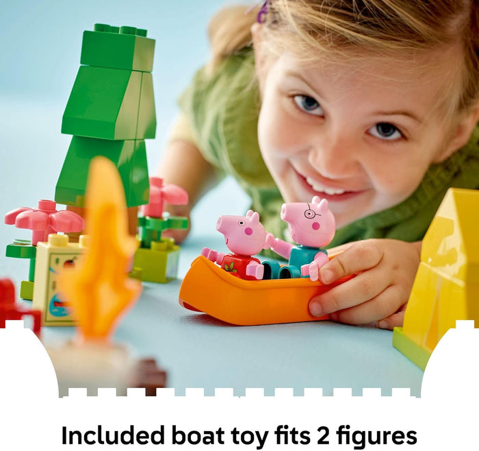 Child playing with a toy boat and figures on a light blue background