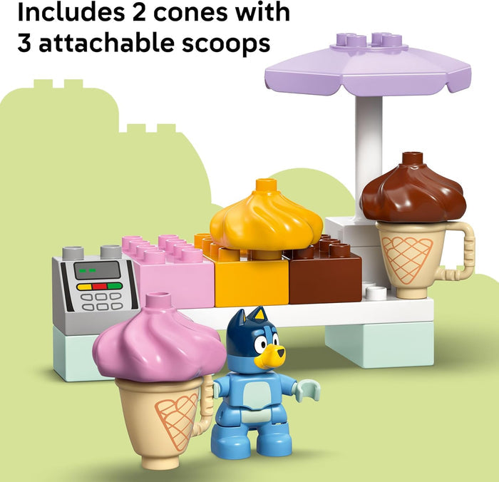 Toy ice cream stand with cones and attachable scoops on a green background