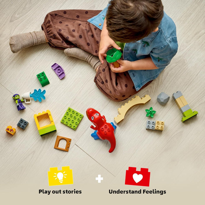 Child playing with colorful building blocks on a light wooden floor.