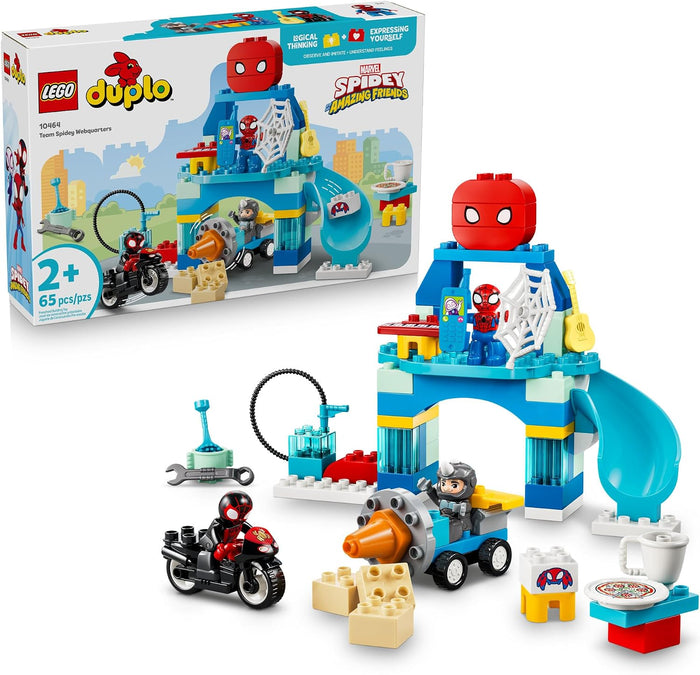LEGO Duplo Marvel Spider-Man Battle Workshop set shown with its retail box and assembled playset pieces on a white background. The set includes a blue workshop structure with a red spider-head topper, a small vehicle, a motorcycle, accessories, and a toy table.