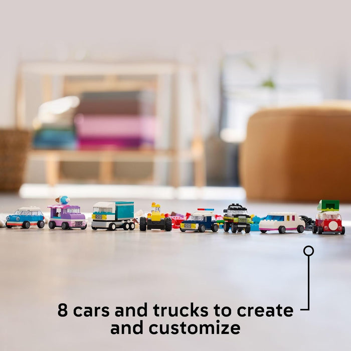 Set of toy cars and trucks on a table with a blurred background