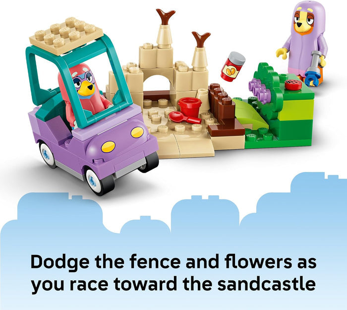 A children's toy building set showing a purple car with a bird character inside, a beige sandcastle structure, green and purple flowers, and a small bird minifigure, with text at the bottom reading 'Dodge the fence and flowers as you race toward the sandcastle'.