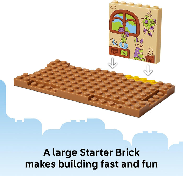 Large brown building brick with a small wooden board featuring a window and cartoon characters on a white background.