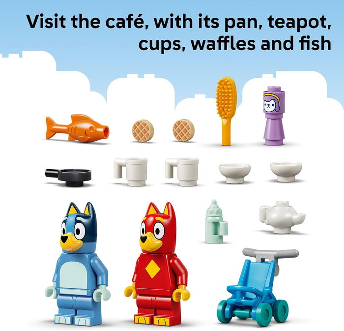 LEGO set with characters and items including a pan, teapot, cups, waffles, and fish on a blue background.