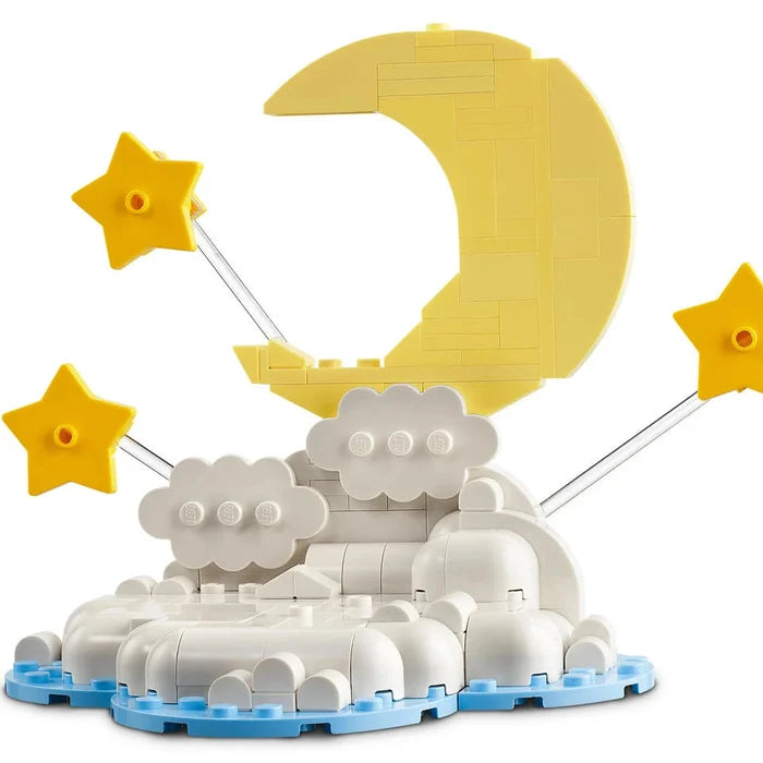 Toy set with moon, stars, and clouds on a white background