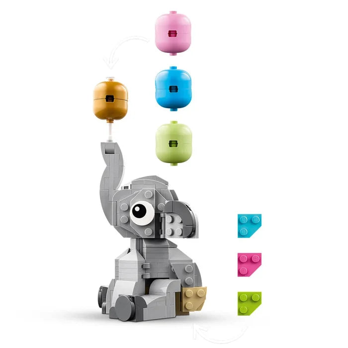 Toy elephant with colorful balloons on a white background