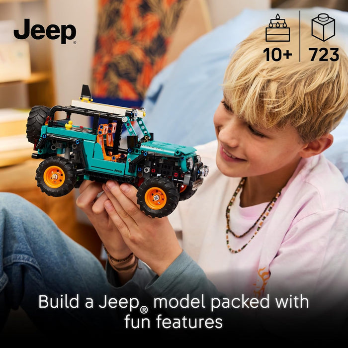 Child holding a Jeep Wrangler Rubicon SUV toy with Jeep branding and product details.