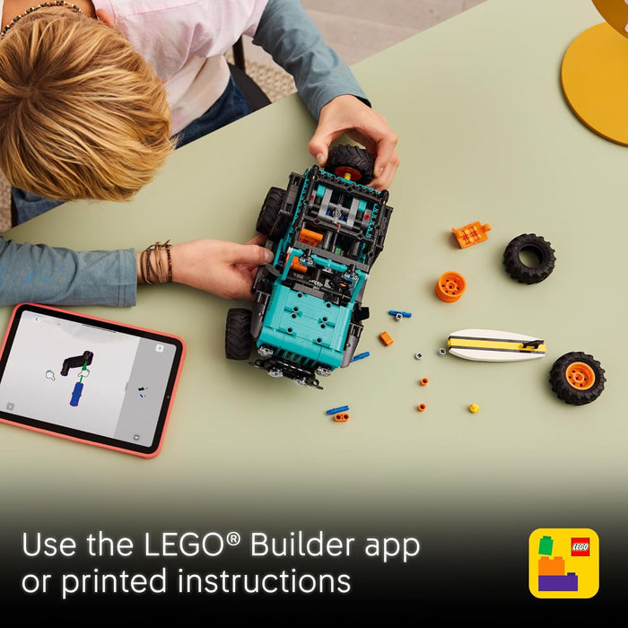 Child building a LEGO Jeep with a tablet displaying the LEGO Builder app on a green table.