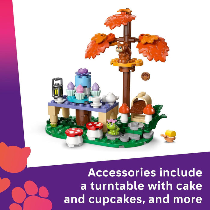 A small toy building-block set displayed on a white background with a purple text banner at the bottom. The set includes a tree with orange leaves, a turntable with cupcakes and cakes, mushrooms, a small animal figure, and other accessories.