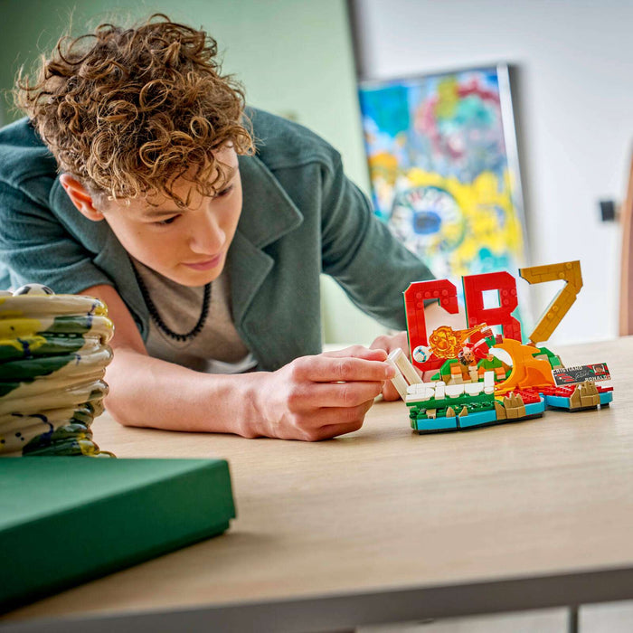 Person playing with colorful building blocks on a table