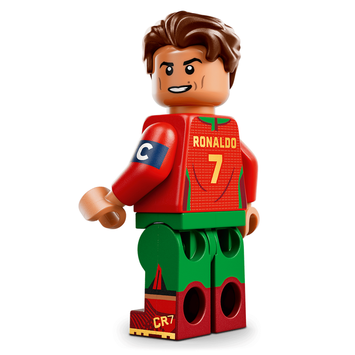 Toy figure of a soccer player in a red jersey with the number 7 on a transparent background