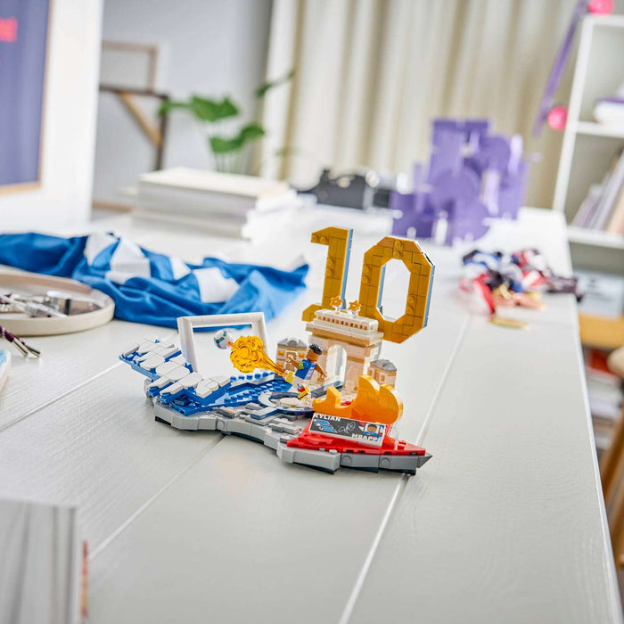 Table with a decorative number '10' and LEGO pieces in a room setting.