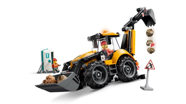 Toy bulldozer with construction accessories on a white background