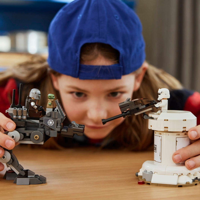Child playing with a detailed toy model on a table