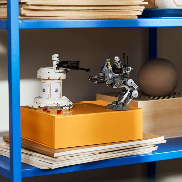 Blue shelf with various items including books, a metallic container, and model robots.