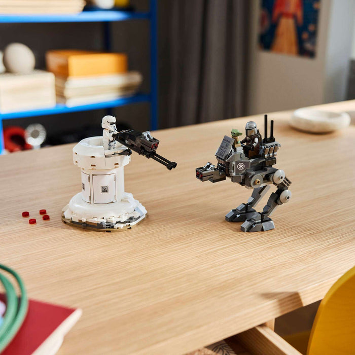 Two small robot models on a wooden table with a blurred background