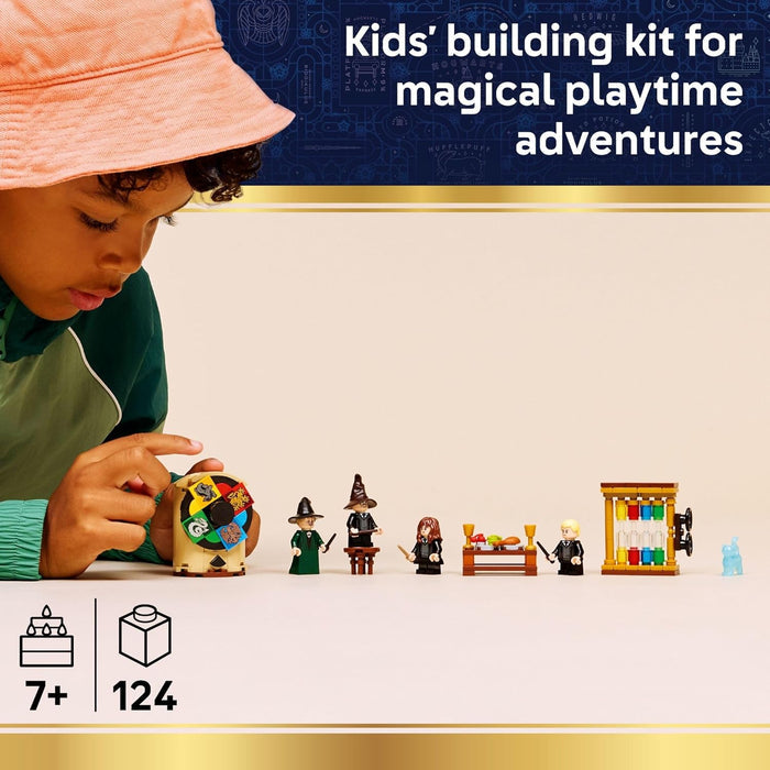 Child playing with a toy building kit featuring characters and items on a beige surface.