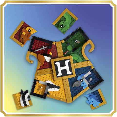 A flat-lay view of a LEGO-style treasure map puzzle piece set on a blue-to-yellow gradient background with a gold border. The central piece features a large white letter 'H' on a black square, surrounded by multiple map tiles showing different colored sections and small illustrated details.