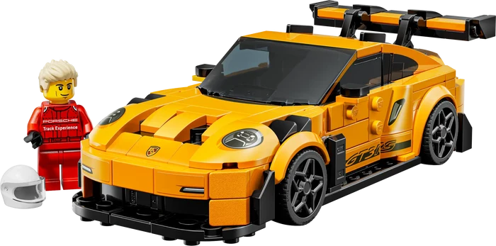 Yellow sports car model made of interlocking bricks with a small figure next to it on a white background