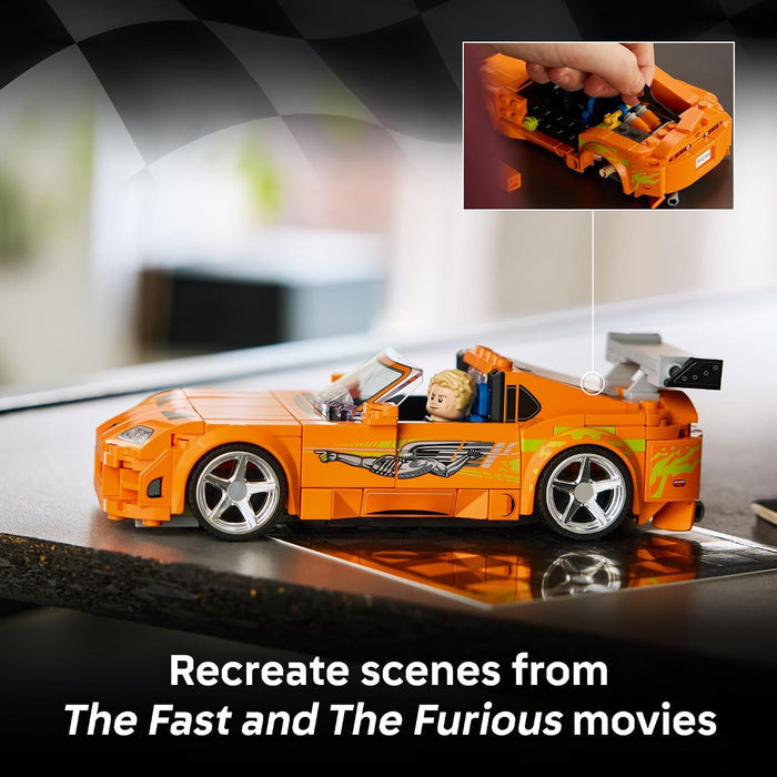 Toy car model from 'The Fast and The Furious' series on a reflective surface with a checkered pattern.