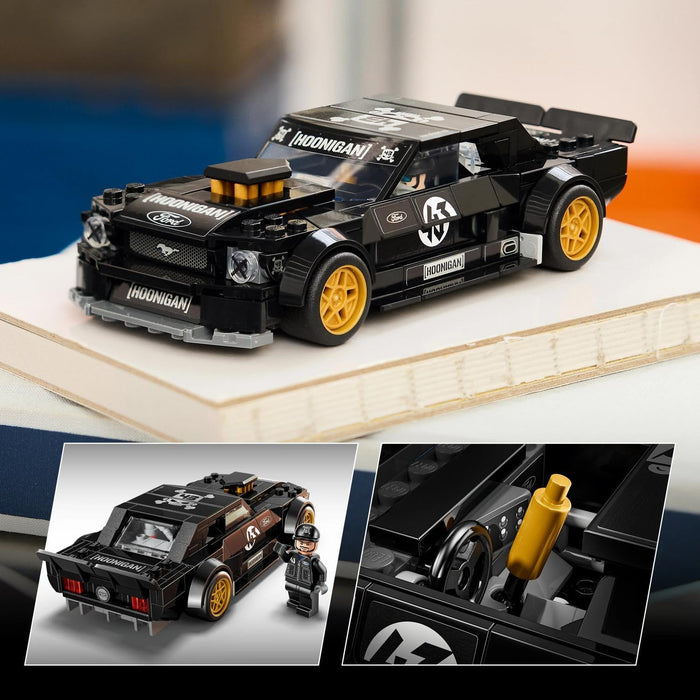 Toy model of a black and yellow race car with detailed components on a white surface.