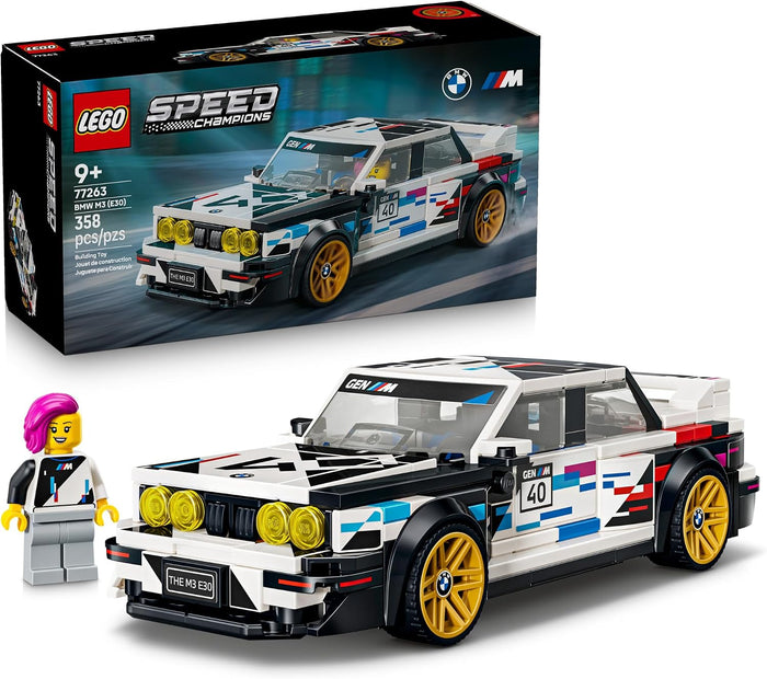 LEGO Speed 1000 Champions BMW M3 Racing Car set (77643), showing the assembled white, black, and blue racing car with gold wheels, a small pink-haired minifigure, and the original product box on a white background.