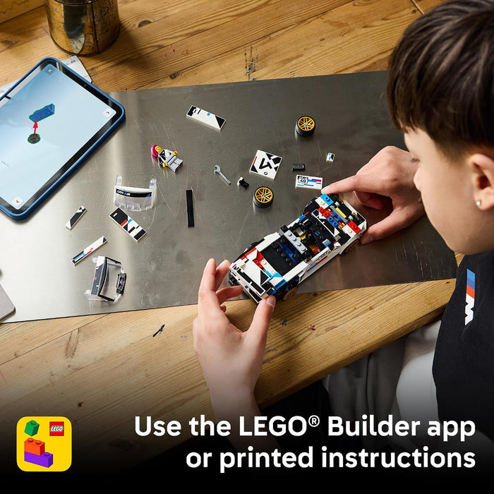 A child builds a small LEGO car on a wooden table, with loose LEGO pieces scattered around and a tablet showing the building app. Text at the bottom says, 'Use the LEGO Builder app or printed instructions.