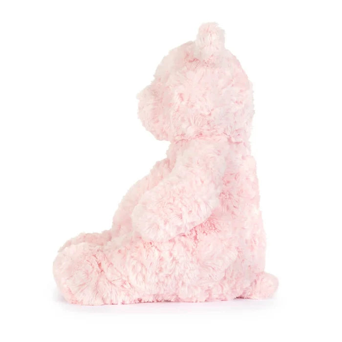 Pink plush bear on a white background