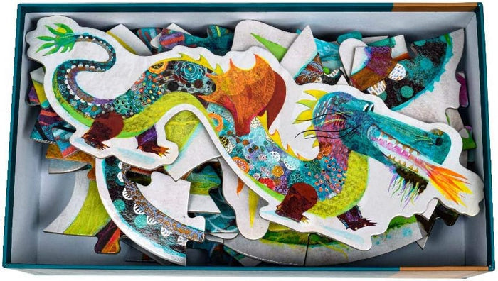 Colorful dragon-shaped puzzle pieces in a box