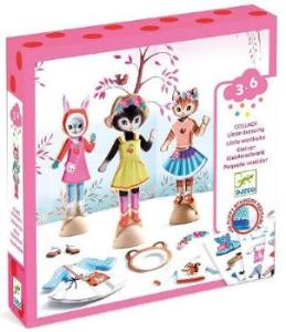 Toy packaging with three cat themed dress up dolls and a tree on a white background
