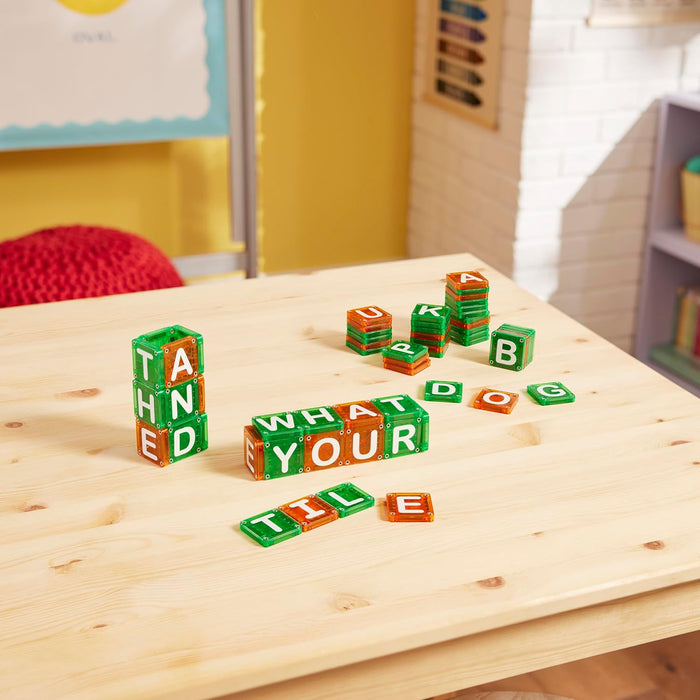 Green and red Learn Letters stacked and connected to make words on a wooden table