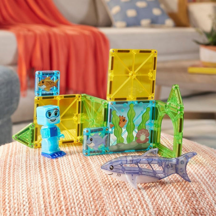 Shark dive tiles with a shark and Scuba diver figure on a fabric table in a living room