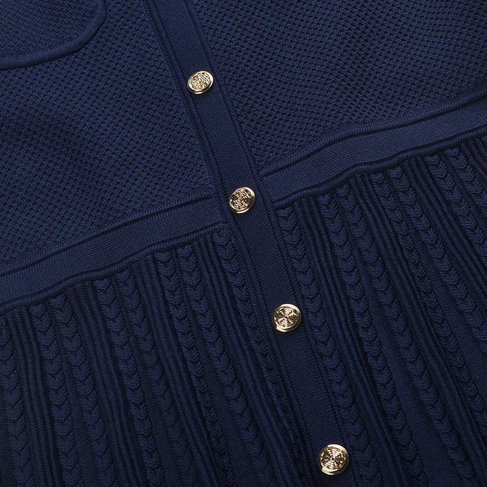Navy blue textured dress with gold buttons on a white background
