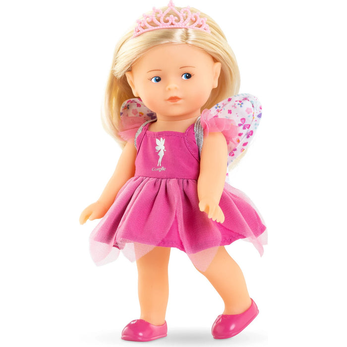 Doll in a pink fairy costume with a tiara and wings on a white background